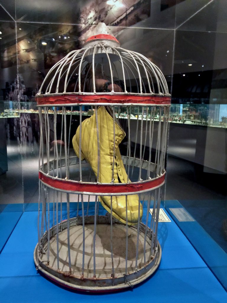 Yellow shoe in a bird cage