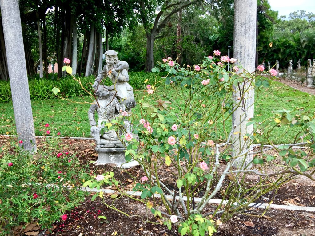 roses with statue in background