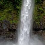 Swimming under the waterfall in Australia