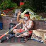 Aboriginal playing didgeridoo